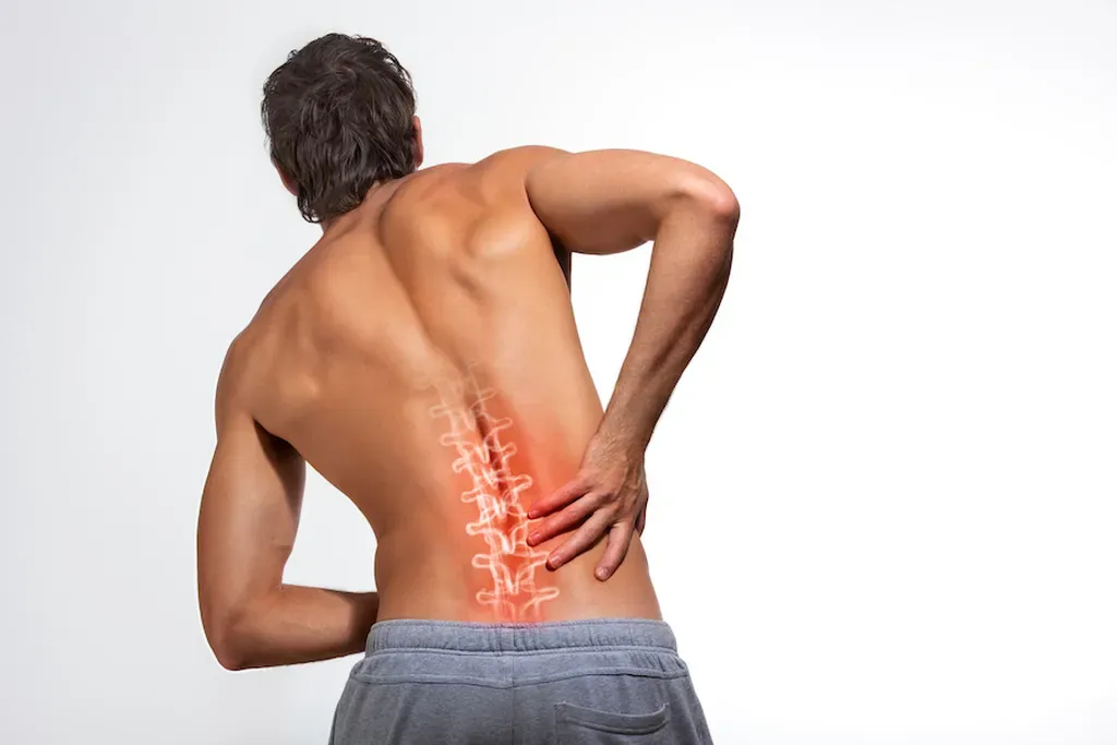 man holding his back from lower back pain. xray of lower back discs